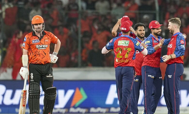 Sunrisers Hyderabad players Klaasen and Kishan celebrating on the field during IPL match.