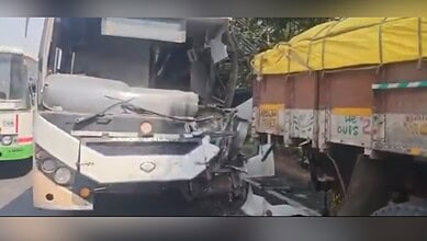 Accident scene showing damaged TGSRTC bus after crash with lorry in Kamareddy.