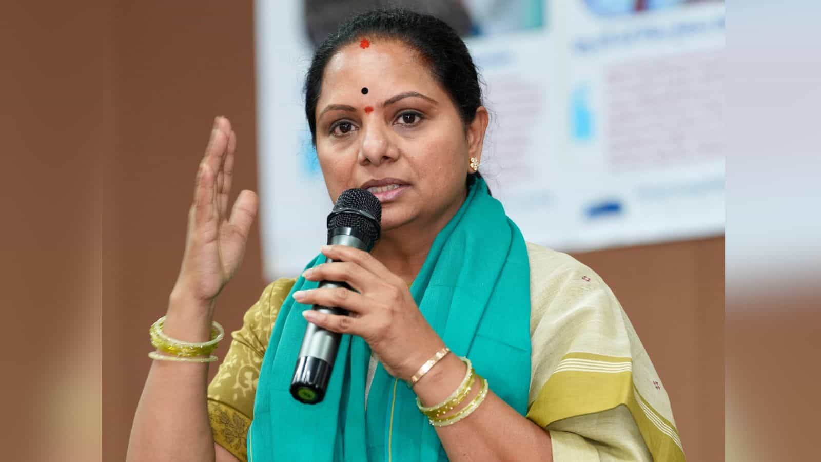 Kavitha speaking at a press conference about farmers' concerns over Pharma City and government transparen.