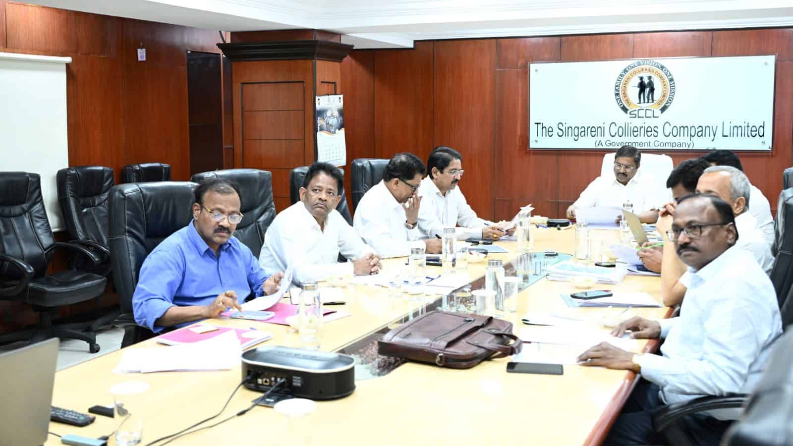 Business meeting at Singareni Collieries Company Limited conference room in India.