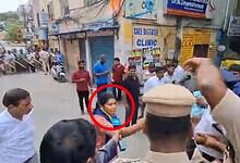 A woman activist detained during protest against PM Narendra Modi's convoy in Secunderabad, surrounded by.