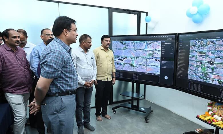 A detailed group of professionals analysing satellite imagery on large screens during a technical present.