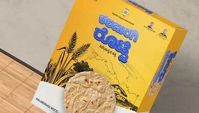 Kalamubari Roti box with wheat illustration and Telugu text, on a wooden surface.