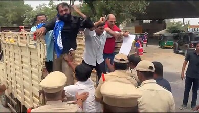 Protesters confront police officers on the street during a public demonstration in India.