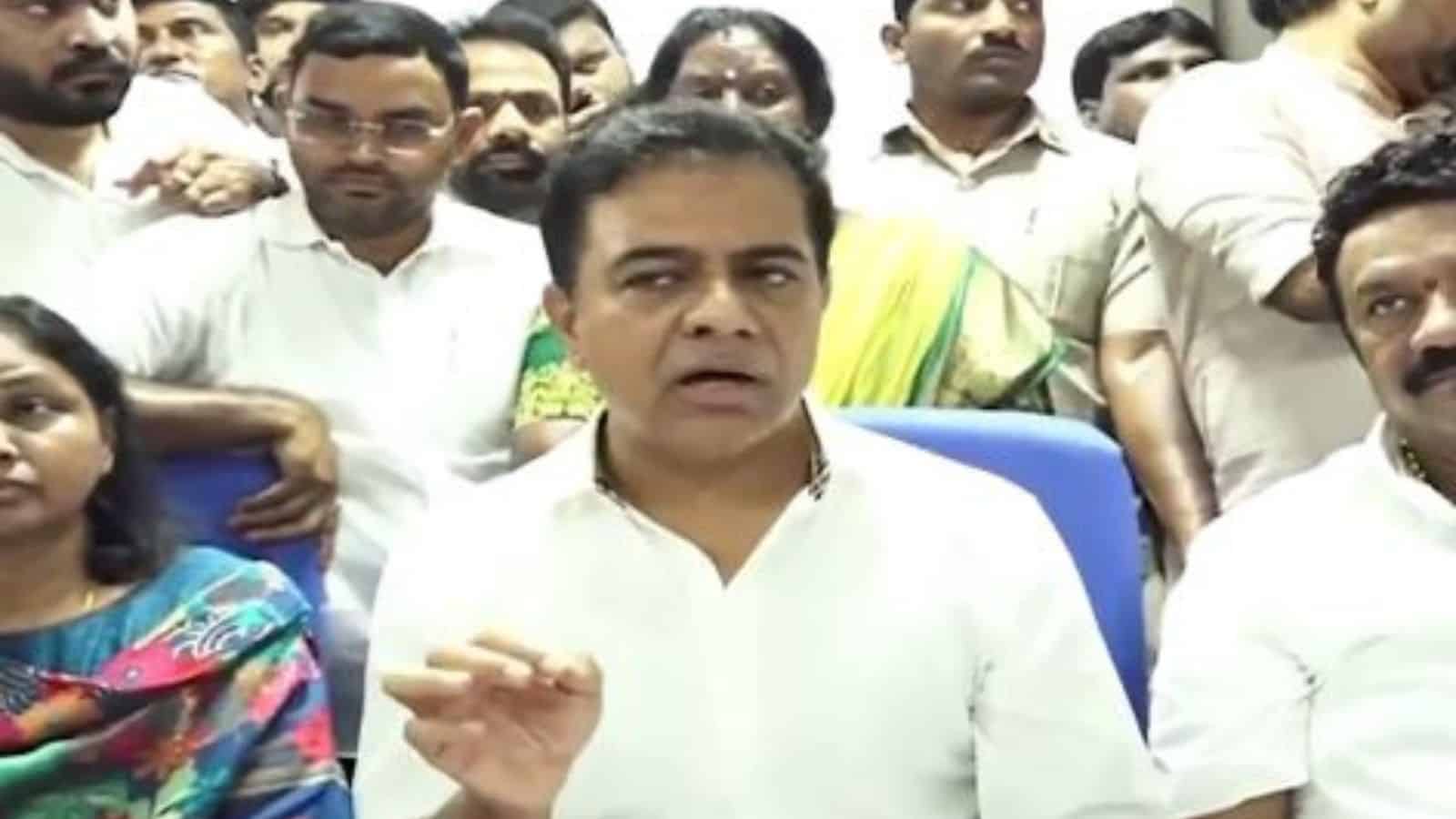 A man speaking to a group of people during a press conference or meeting.