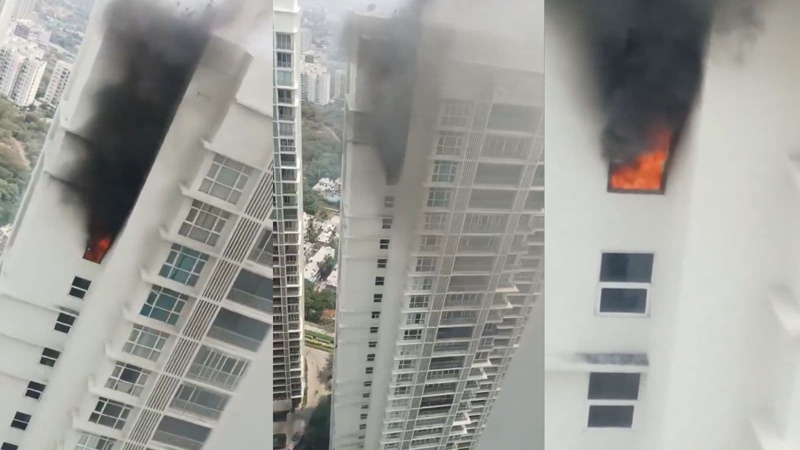 Fire and smoke emerging from a high-rise building window during a daytime fire incident.