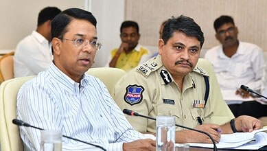 Senior officials attending a formal meeting, discussing security and administrative matters in a professi.