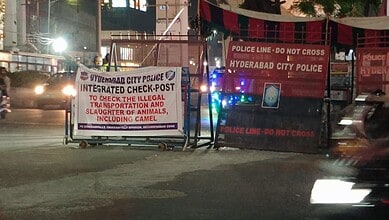 Police barricades and signage at Hyderabad City Police checkpoint for illegal transportation and slaughte.