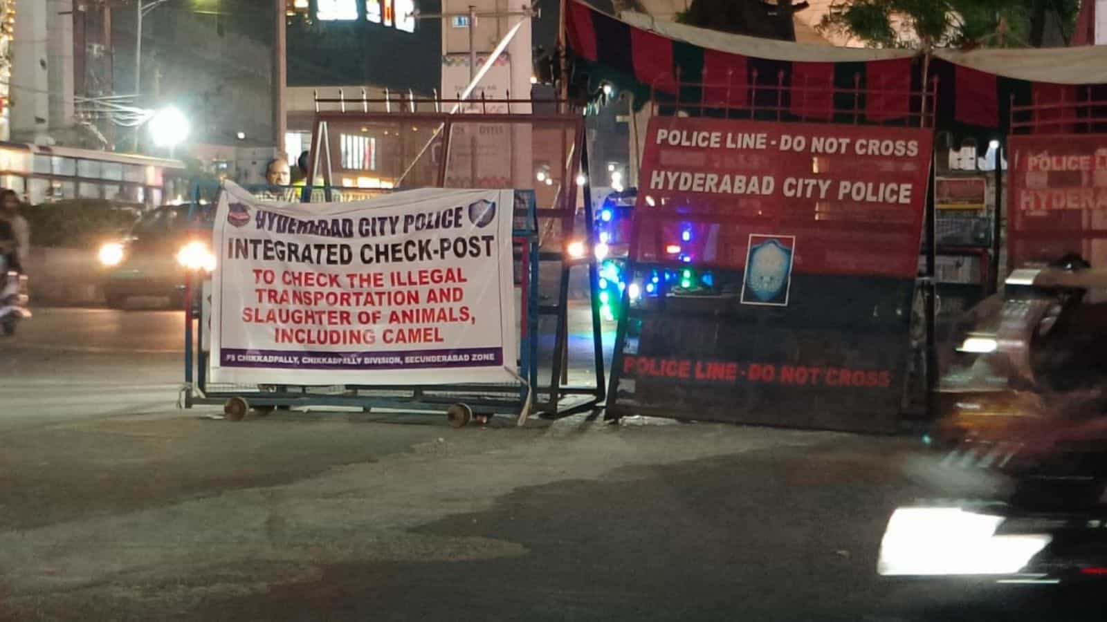 Police barricades and signage at Hyderabad City Police checkpoint for illegal transportation and slaughte.