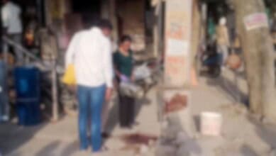 People at the crime scene in Delhi
