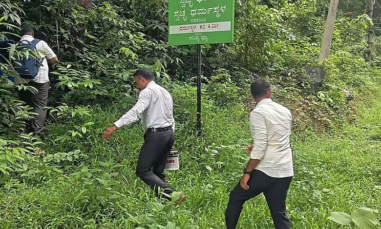 Group of men walking through dense green forest near a signboard in India.