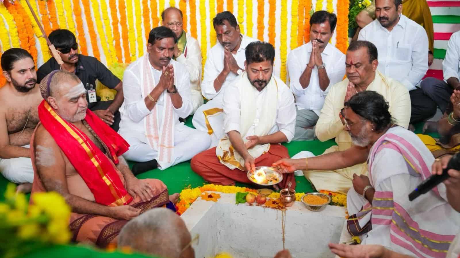 Traditional Indian religious ceremony with priests and devotees during a spiritual event.