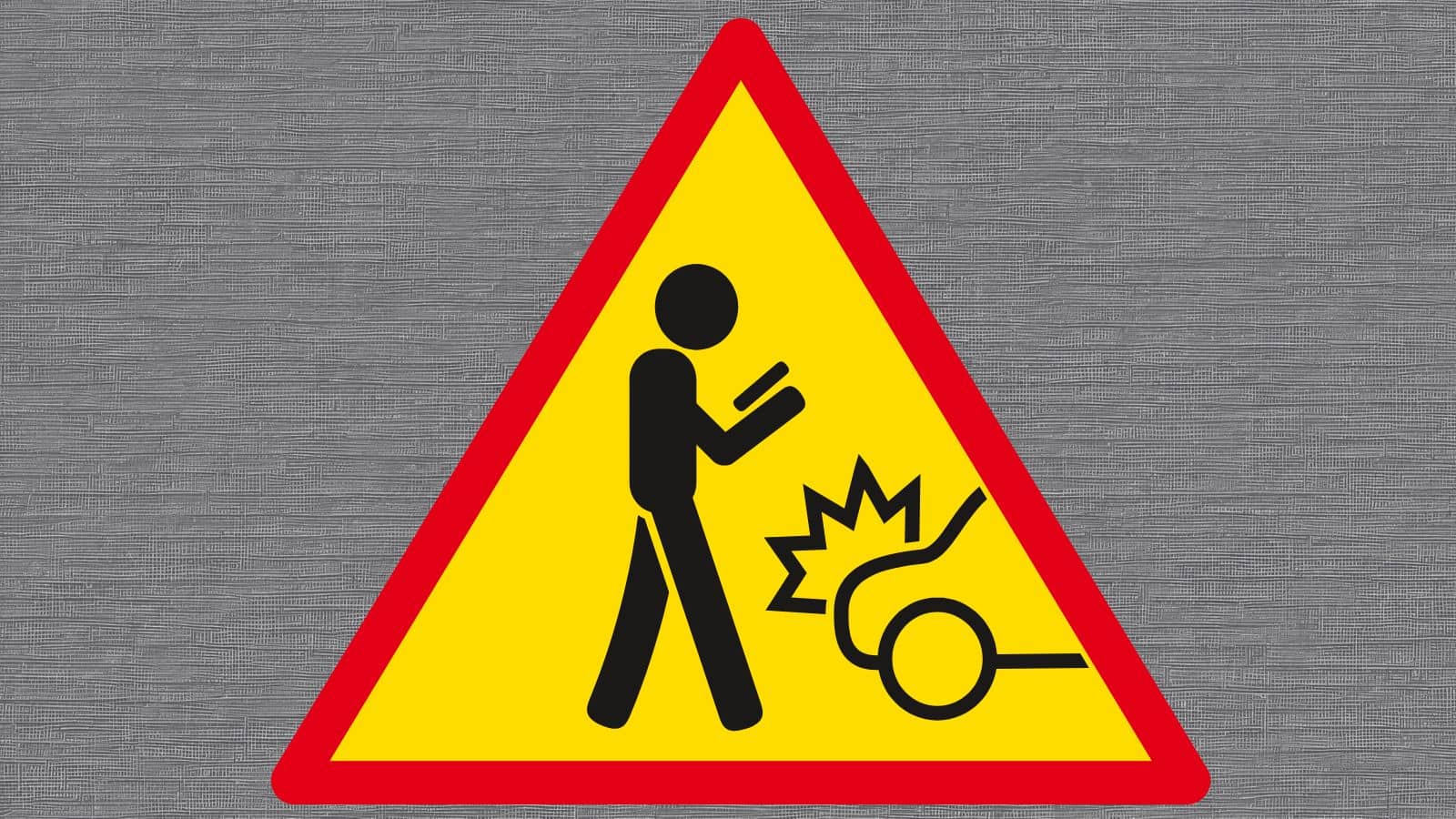 Caution sign warning of a falling object or hazard with a person and an impact symbol.