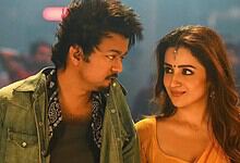 A vibrant scene from a Tamil movie featuring Thalapathy Vijay and Trisha in a romantic moment.