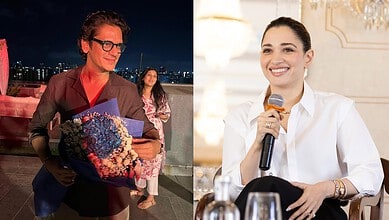 Vijay Varma and Tamannaah Bhatia at a public event, smiling and engaging with the audience, amid rumours.