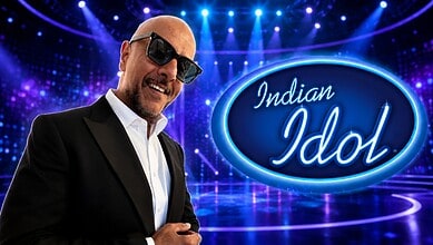 Bright Indian Idol contestant performing on stage with vibrant lighting and a large Indian Idol logo in t.