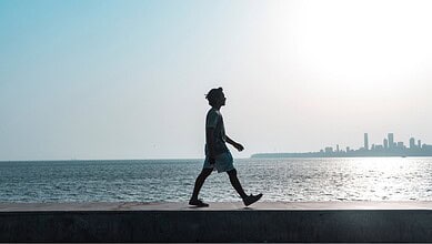 Person walking along Necklace Road during the Census 2027 walkathon in Hyderabad.