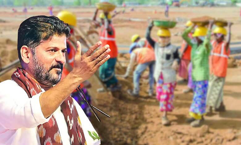 Politician speaking to workers at a construction site with a group of women in safety helmets in the back.