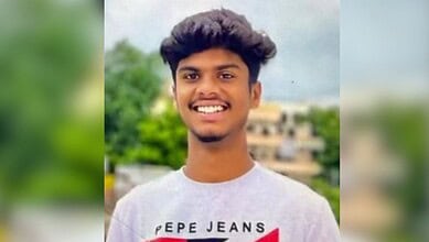 Young engineering student smiling outdoors in Hyderabad, India, after a tragic stabbing incident related.
