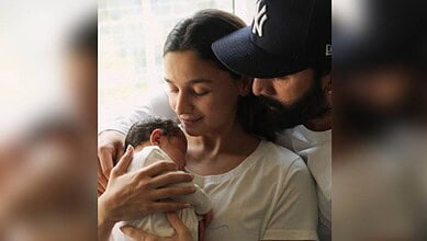Alia Bhatt and Ranbir Kapoor with their newborn, celebrating their growing family.
