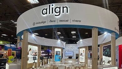 Trade show booth for Align Dental Care featuring Invisalign, iTero, Exocad, and Vivera products.