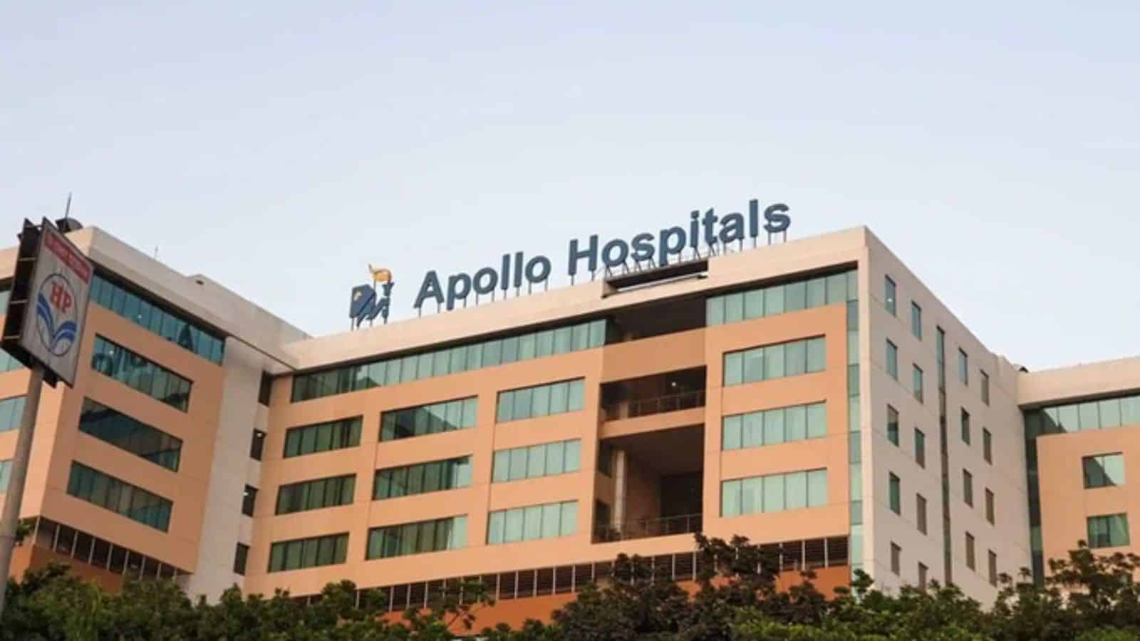 Modern Apollo Hospitals building with clear signage and contemporary architecture in an urban setting.