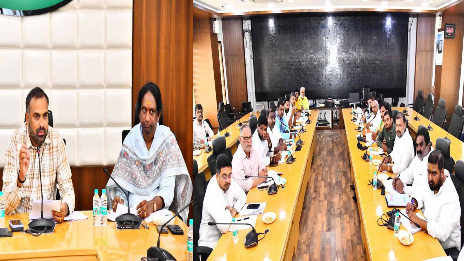The Siasat Daily: Business meeting with diverse professionals in a modern conference room.