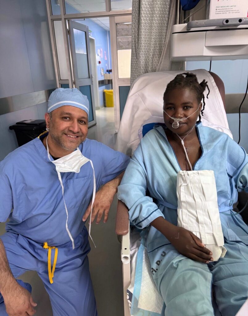 Dr Amjad Syed with a young patient recovering from heart surgery in Nairobi, Kenya.