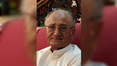 Dr Mohammad Iqbal Sanai seated and smiling in Hyderabad before his passing.