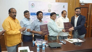 The Siasat Daily: Signing ceremony with officials holding documents at a formal event.