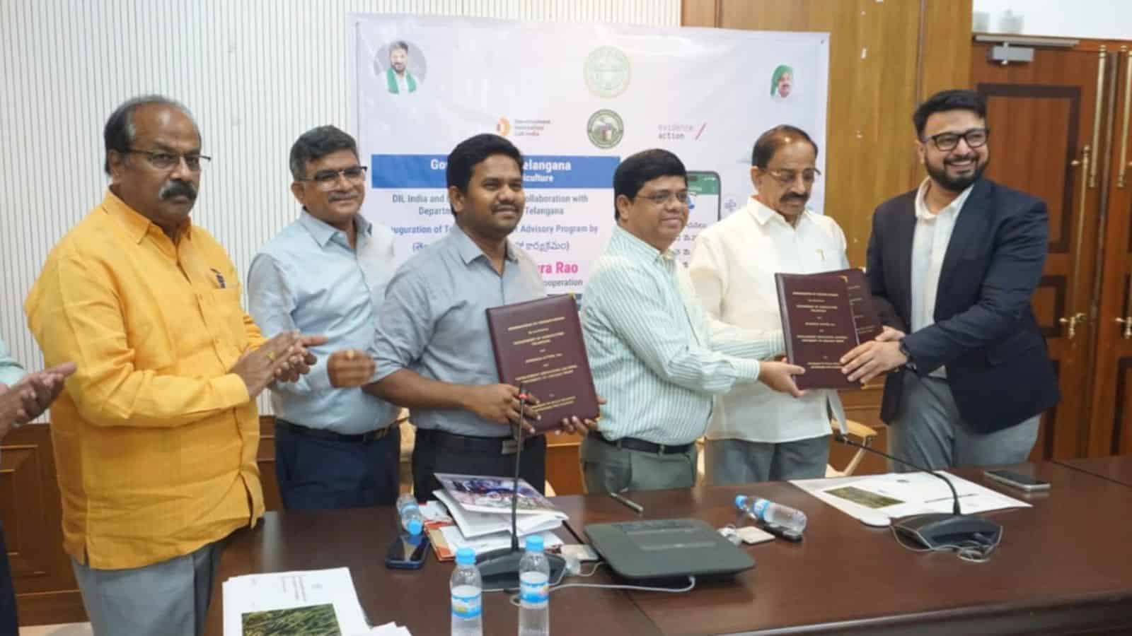 The Siasat Daily: Signing ceremony with officials holding documents at a formal event.