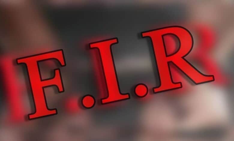 F.I.R. emergency fire response sign with bold red letters on a blurred background.