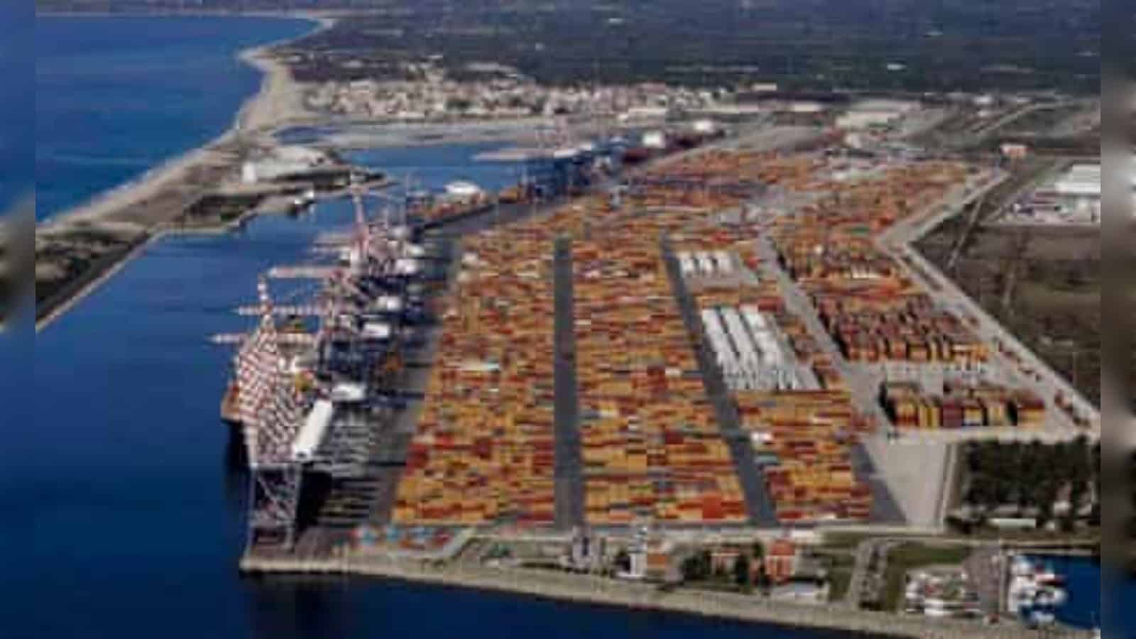 Port of Dubai with shipping containers and cranes for cargo handling and logistics.