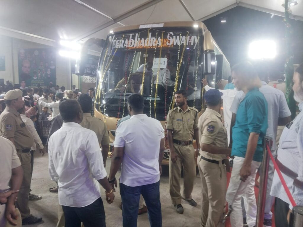 Haj pilgrims' first batch flagged off by Mohammed Azharuddin at the airport, surrounded by officials and.