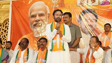 People practicing Bhujangasana yoga pose during record event in Hyderabad.