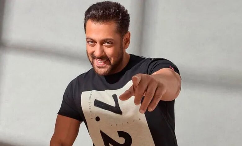 Salman Khan smiling and pointing at the camera, promoting his upcoming film.