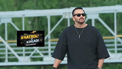 A man with sunglasses and a black outfit standing outdoors, promoting Khatron Ke Khiladi 15 TV show.