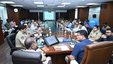 Business leaders and officials attending a formal meeting in a modern conference room.