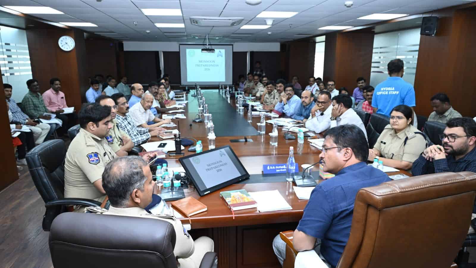 Business leaders and officials attending a formal meeting in a modern conference room.