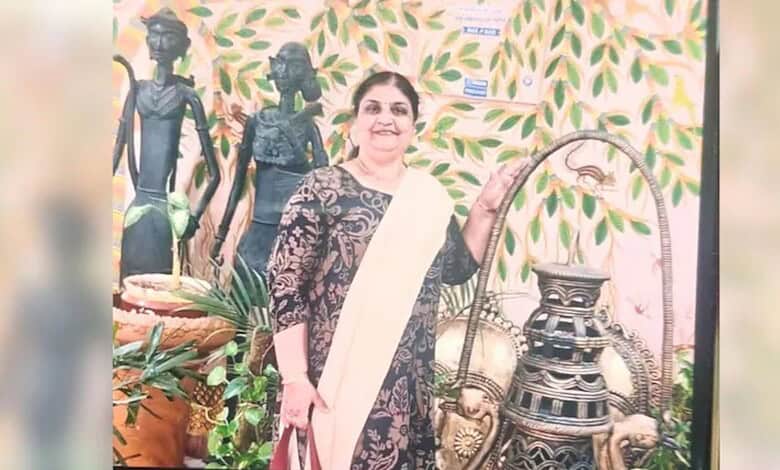 Traditional Indian woman with cultural artifacts and greenery background.
