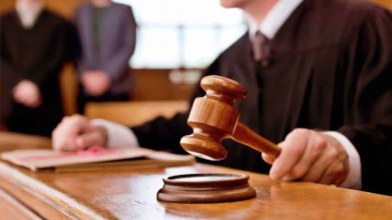 Gavel being used in a courtroom for legal proceedings and justice delivery.