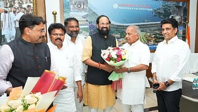 Prominent officials and dignitaries at the Siasat Daily event, exchanging flowers and greetings in a form.