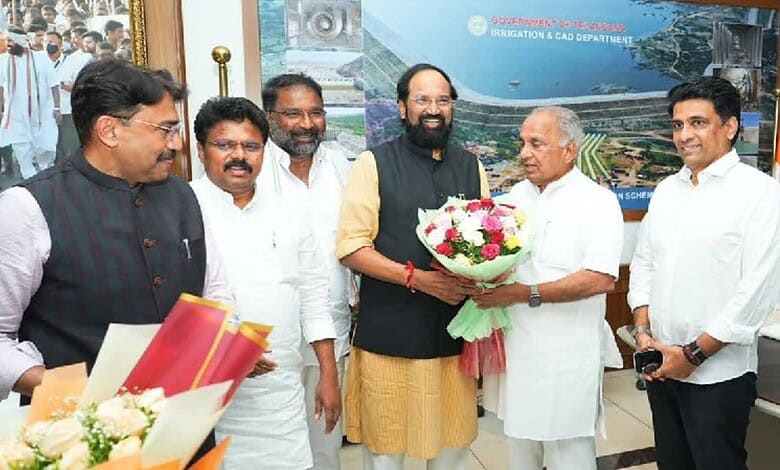 Prominent officials and dignitaries at the Siasat Daily event, exchanging flowers and greetings in a form.