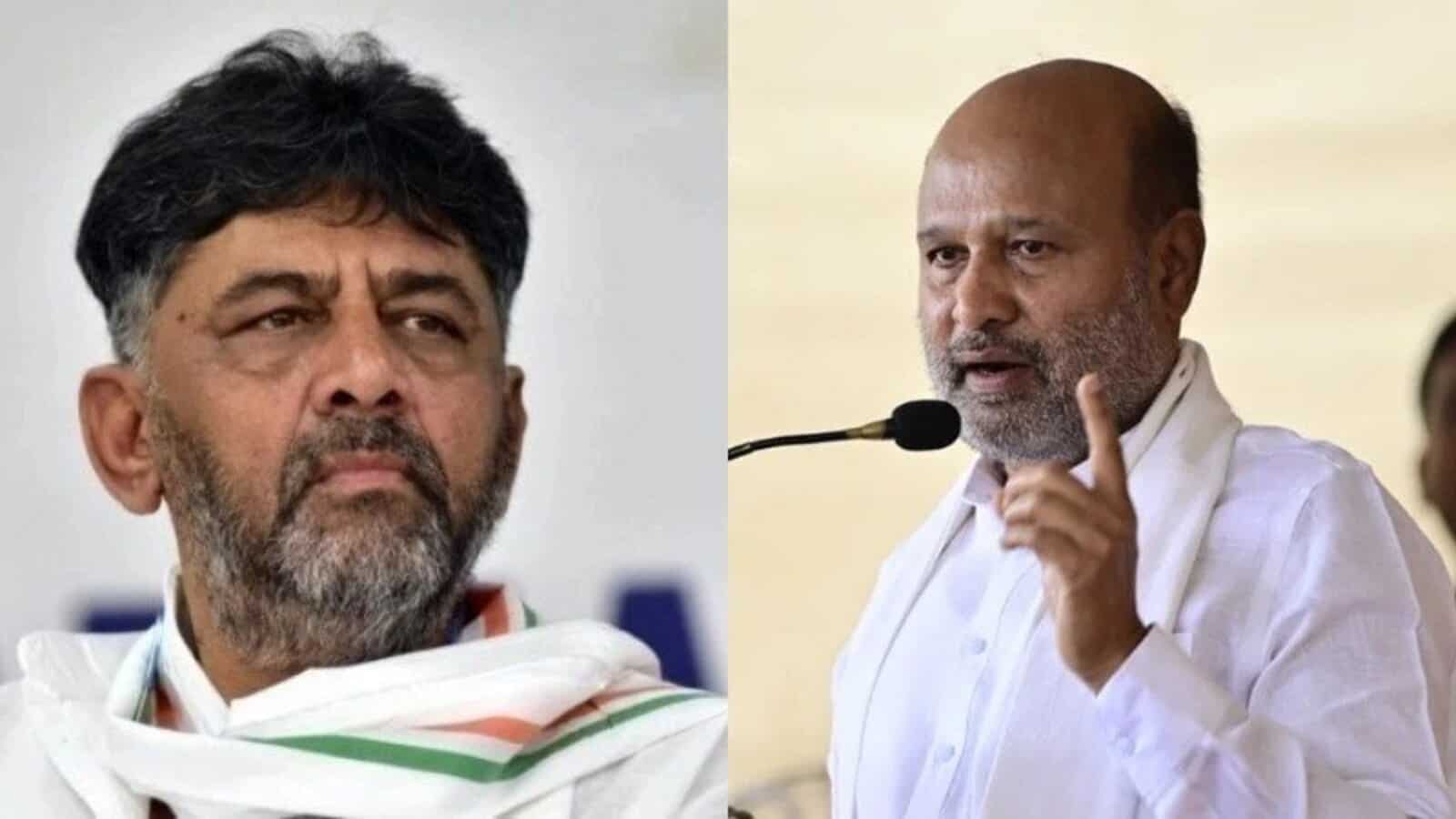 Indian politician speaking passionately at a public event, wearing white traditional attire and gesturing.