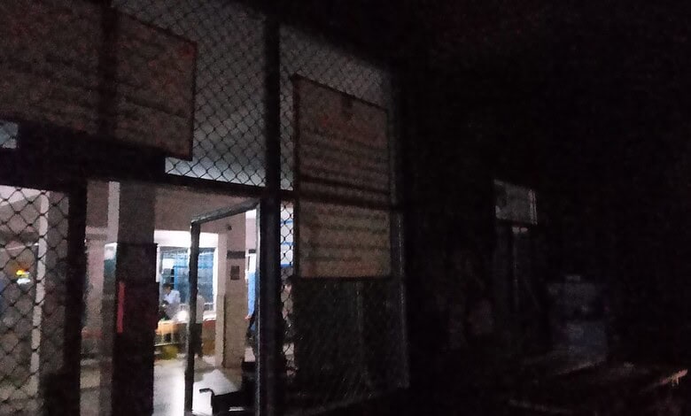 Night view of Siasat Daily office entrance with illuminated interior and exterior lighting, behind a meta.