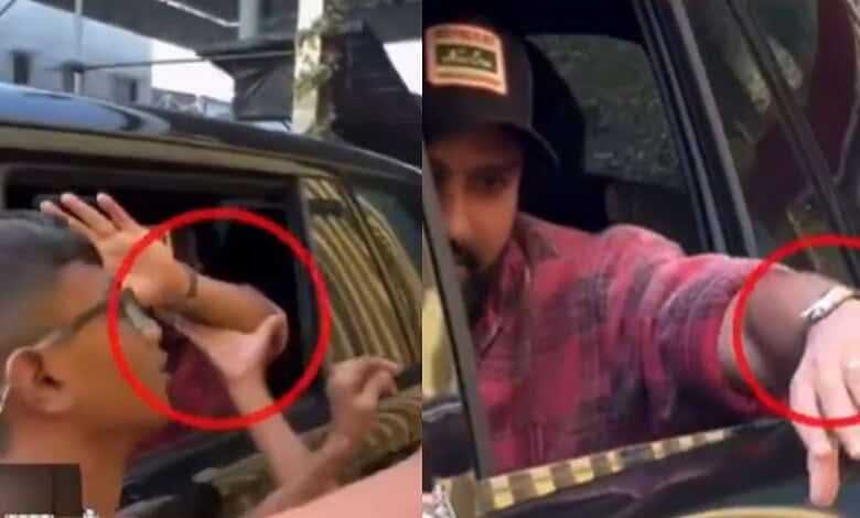 A young boy attempting to snatch Rohit Sharma's Rs 3 crore watch from a car window.
