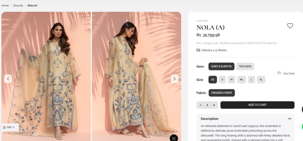 Elegant traditional South Asian dress with intricate embroidery, worn by a model in a fashion photoshoot.