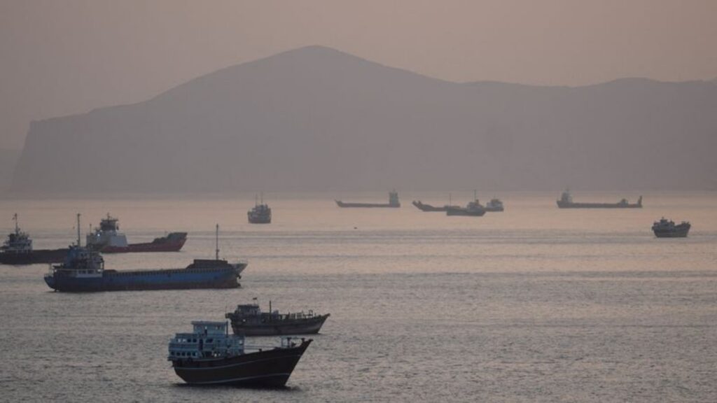 Ship rescue operation in Hormuz Strait during geopolitical tensions.