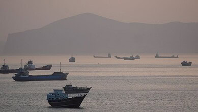 Ship rescue operation in Hormuz Strait during geopolitical tensions.