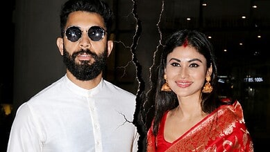 Suraj Nambiar and Mouni Roy at an event, with Suraj Nambiar deleting all pictures with Mouni Roy amid div.
